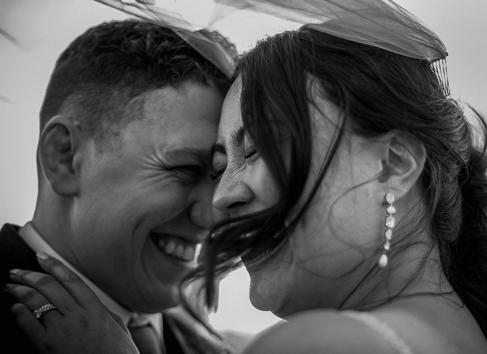 The newly-wedded couple dancing at dusk under warm lights