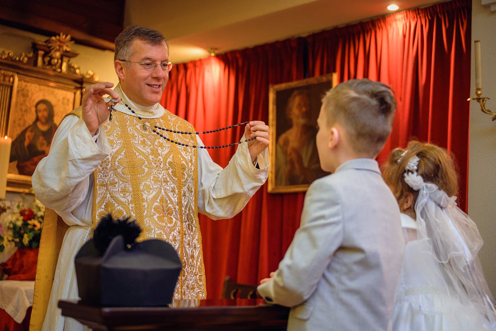 The pouring of water over the child’s forehead at the baptismal font