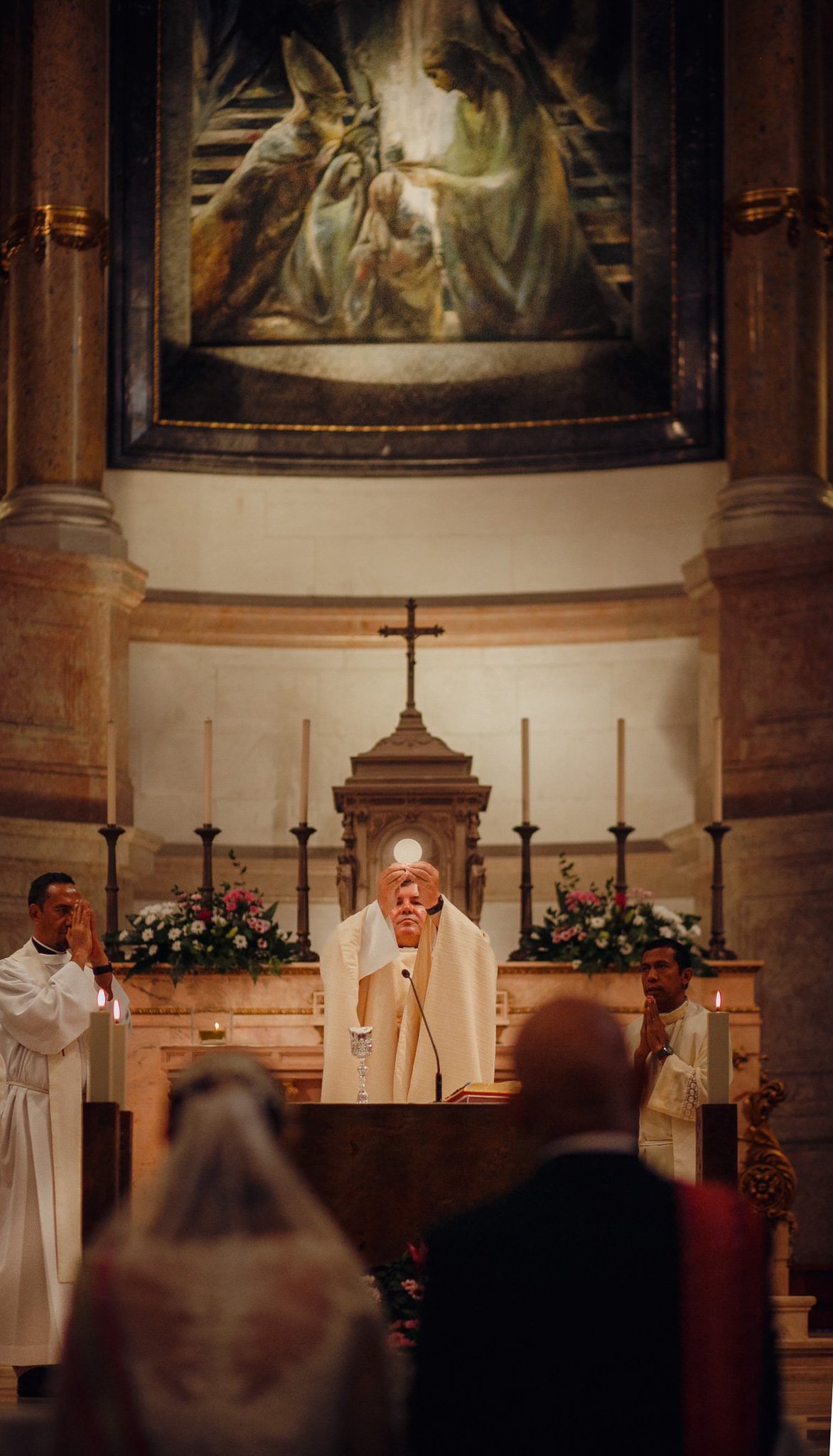 The blessing of the nuptial rings upon the stone altar